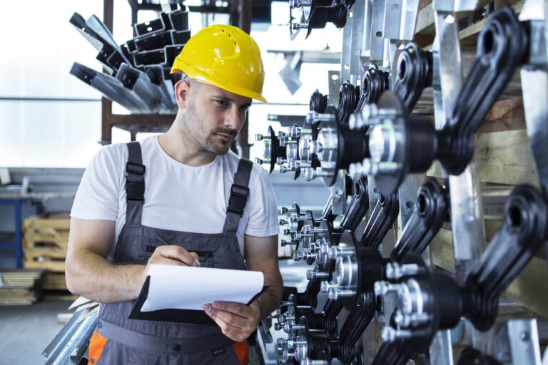 industrial-employee-wearing-uniform-yellow-hardhat-checking-production-factory-min