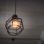 low-angle-view-illuminated-light-bulb-hanging-from-ceiling-min